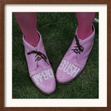 A Code Pink Member Demonstrates Her Feelings for President Bush During a Rally Opposing the War Framed Photographic Print