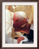 Pope John Paul II Kisses the Foot of a Clergyman Framed Photographic Print