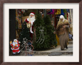 Palestinian Woman Walks Past Christmas Decorations at a Shop in Jerusalem's Old City Framed Photographic Print