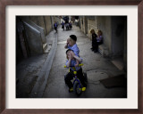 Ultra-Orthodox Jewish Children Cover their Faces as They Play in a Street in Jerusalem Framed Photographic Print