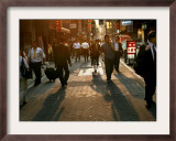 Japanese Commuters Walk Through a Tokyo Street on Their Way to the Train Stations Framed Photographic Print by David Guttenfelder