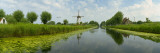 Traditional Windmill Along With a Canal, Damme, Belgium Wall Decal by  Panoramic Images