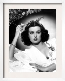 She Knew All the Answers, Joan Bennett, Reclining and Touching a Flower, 1941 Prints