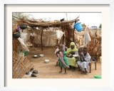 A Sudanese Family is Seen Inside Their Thatched Hut During the Visit of Unicef Goodwill Ambassador Framed Photographic Print
