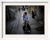 Ultra-Orthodox Jewish Children Cover their Faces as They Play in a Street in Jerusalem Framed Photographic Print