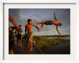 Youths Play in a Lagoon Near the Eastern Beni State Capital of Trinidad, Bolivia Framed Photographic Print