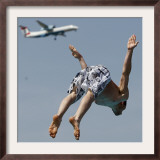 Man Jumps Close to a Landing Airplane in a Public Bath in Duesseldorf, Western Germany Framed Photographic Print