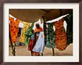 A Sudanese Woman Buys a Dress for Her Daughter at the Zamzam Refugee Camp Framed Photographic Print by Nasser Nasser