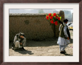 A Man Ignores a Passing Photographer Who Continues His Way Looking for Clients Framed Photographic Print