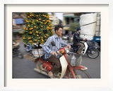 A Vietnamese Vendor Races Down a Street on a Motorbike Carrying a Kumquat Tree for Sale Framed Photographic Print