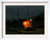 A Boy Prepares to Sell Bread Framed Photographic Print