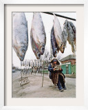 A Woman Selling Dried Fish Waits for Customers on the Outskirts of Rostov-On-Don Framed Photographic Print