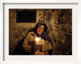 Elderly Woman Holds a Candle as She Takes Part in a Procession During Holy Week in Taxco, Mexico Framed Photographic Print