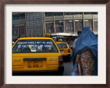 An Afghan Woman Clad in a Burqa Walks Next to a Taxi in Kabul, Afghanistan, Wednesday, June 7, 2006 Framed Photographic Print by Rodrigo Abd