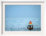 A Devotee Immerses the Idol of Elephant-Headed Hindu God Ganesh Framed Photographic Print