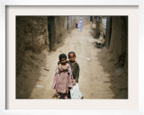 In an Alley While Waiting for the Rest of their Friends in a Poor Neighborhood in Pakistan Framed Photographic Print