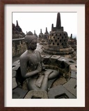 A Statue of Buddha Sits on a Terrace Framed Photographic Print by Dita Alangkara