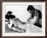 An Unidentified Japanese Tattoo Artist Works on a Woman's Backside Framed Photographic Print