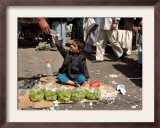 Afghan Child 5, Receives a Bottle of Water Framed Photographic Print by Musadeq Sadeq