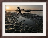 A Boy Plays on the Banks of the River Brahmaputra in Gauhati, India, Friday, October 27, 2006 Framed Photographic Print by Anupam Nath