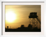 Camp Warhorse Guard Tower at Sunset Posters by Stocktrek Images 
