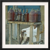 A Petrol Vendor Waits for Customers on the Streets of Chad's Capital Framed Photographic Print