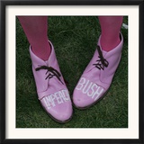 A Code Pink Member Demonstrates Her Feelings for President Bush During a Rally Opposing the War Framed Photographic Print