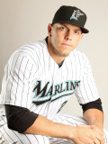 Florida Marlins Photo Day, JUPITER, FL - FEBRUARY 23: Logan Morrison Photographic Print by Mike Ehrmann