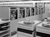 Office Interior With Rows of Large Computer Disk Drive Machines Photographic Print by H. Armstrong Roberts