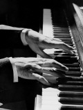 Man's Hands Playing Piano in Dim Lighting Photographic Print by H. Armstrong Roberts