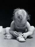 Baby Leaning Over Playing With Shoe Photographic Print by H. Armstrong Roberts