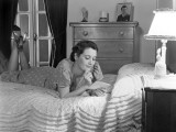 Woman Lying on Bed Reading Letter Photographic Print by H. Armstrong Roberts
