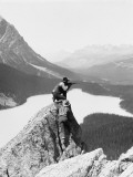 Two Cowboys on Top of Rocky Crag, One Man Kneeling, Aiming Hunting Rifle Photographic Print by H. Armstrong Roberts Two Cowboys on Top of Rocky Crag, One Man Kneeling, Aiming Hunting Rifle Photographic Print by H. Armstrong Roberts