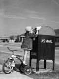 Girl Standing on Tricycle on Suburban Sidewalk, Mailing Letter in Mailbox Photographic Print by H. Armstrong Roberts