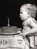 Baby Girl One Year Old Blowing Out Candle on Birthday Cake Photographic Print by H. Armstrong Roberts