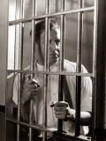 Man Gripping Bars Photographie par H. Armstrong Roberts