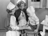 Two Young Girls Dressed As Nurses, Bandaging Three Year Old Boy's Head and Foot Fotografie-Druck von H. Armstrong Roberts