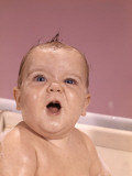 Portrait of Baby in Bath Making a Face Photographic Print by H. Armstrong Roberts