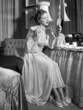 A Woman in Her Nightgown Looking in the Mirror Photographic Print by George Marks