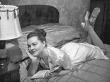 Woman in Silk Night Gown Reading on Bed Photographic Print by George Marks