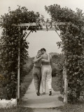Romantic Couple Walking Through Rose Arbor Photographic Print by George Marks Romantic Couple Walking Through Rose Arbor Photographic Print by George Marks