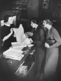 Sales Clerk Presenting Lingerie To Clients Photographic Print by George Marks