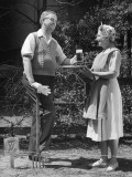 Man Working in Garden, Receiving Beer Photographic Print by George Marks Man Working in Garden, Receiving Beer Photographic Print by George Marks