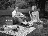 Couple Outdoors Having a Picnic Photographic Print by George Marks
