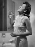 Woman Gargling Water at Bathrom Sink Photographic Print by George Marks