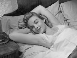 Woman Lying in Bed Photographic Print by George Marks