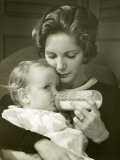 Mother Feeding Baby Girl Photographic Print by George Marks