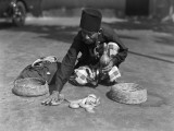 Snake Charmer Handling Snake Basket, Singapore Photographic Print by Charles Phelps Cushing