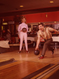 1960's Era Couple Bowling in Tenpin Bowling Alley Photographic Print by L. Willinger