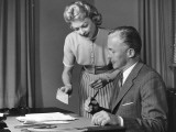 Woman Showing Man Cheque, Man Holding Pen Photographic Print